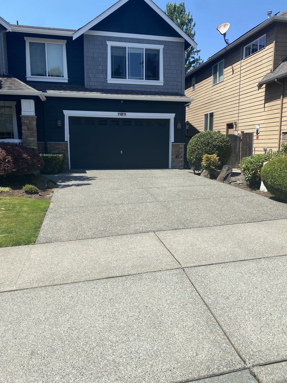 A freshly pressure-washed home and driveway in Redmond